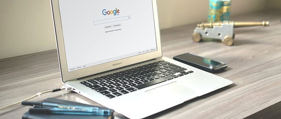 macbook air on grey wooden table