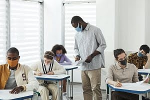 people wearing face mask inside the classroom