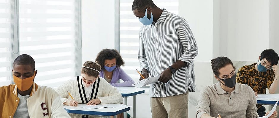 people wearing face mask inside the classroom